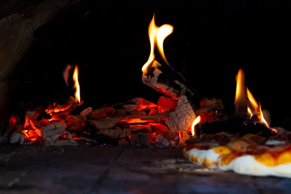 coal fired pizza oven flames glowing