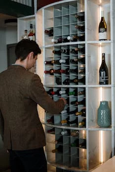 sommelier selecting wine bottles
